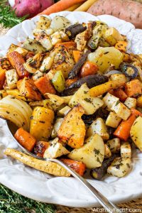 Roasted vegetables with lamb fat, crispy herb crust recipe, healthy gourmet side dishes.